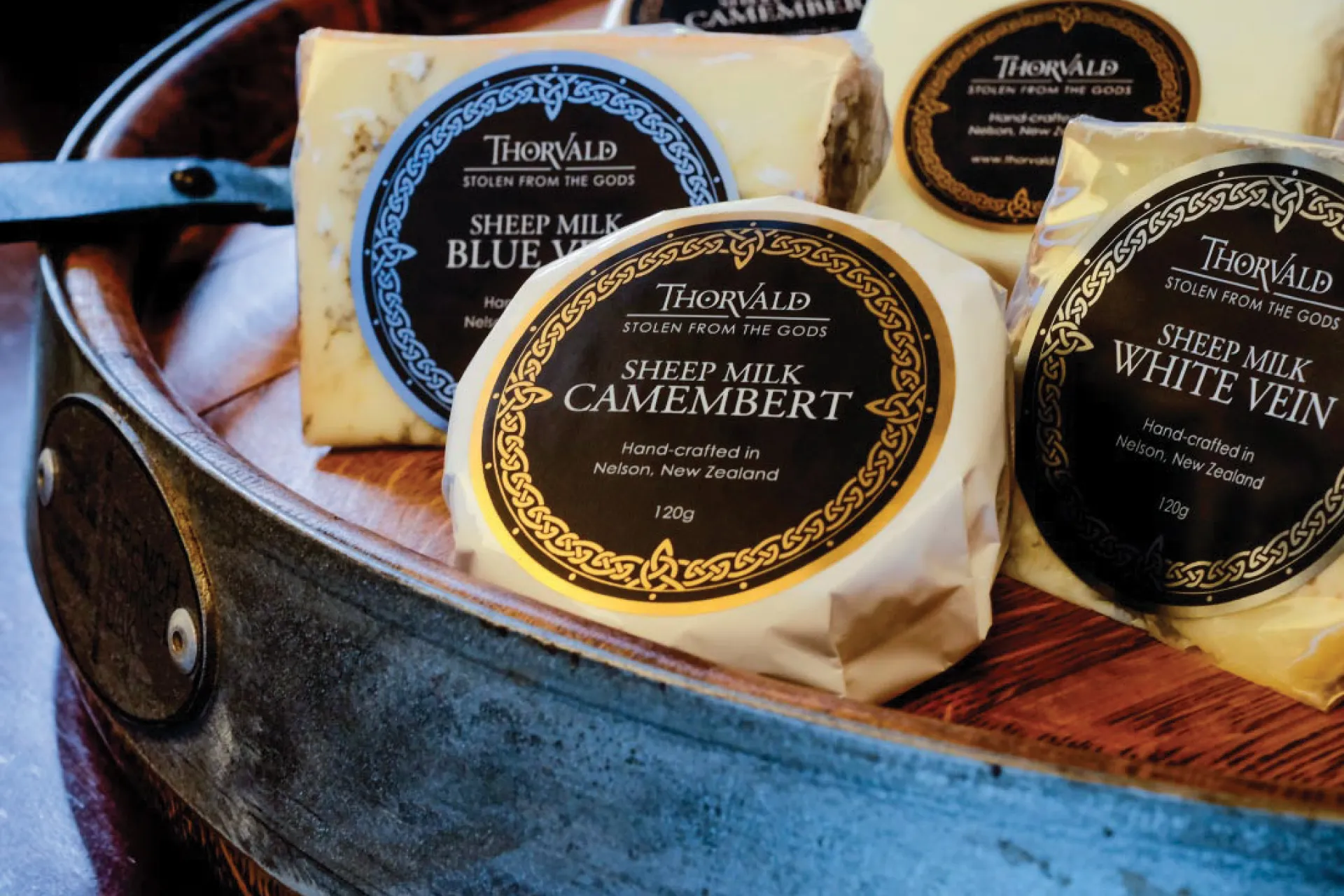 Thorvald sheep-milk cheeses — blue vein, camembert and white vein — arranged in a presentation tin.